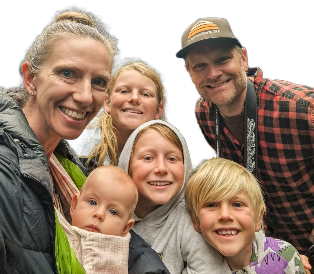 Dr Tania Mitchell with her husband Marcus and their four kids, squeezed into a family selfie